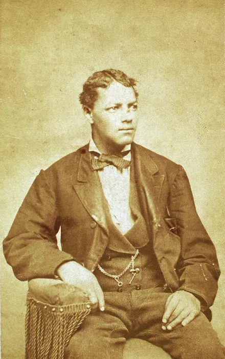 Framed Print : Studio portrait of unidentified seated young man, his left arm resting on chair, c1870-c1879. Creator: Unknown Framed Print : Studio portrait of unidentified seated young man, his left arm resting on chair, c1870-c1879. Creator: Unknown