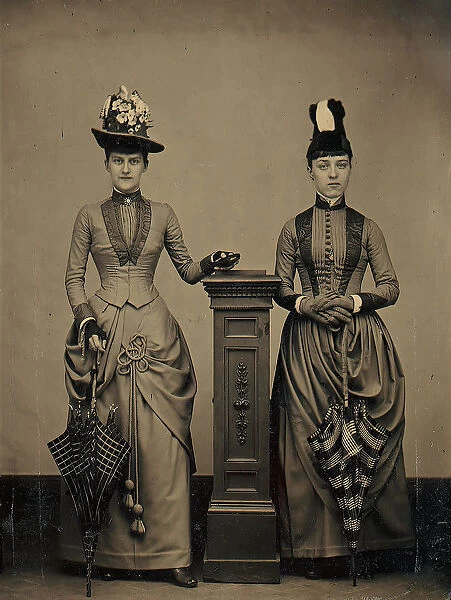 Studio Portrait of Two Women Holding Folded Parasols, ca. 1885. Creator: Unknown