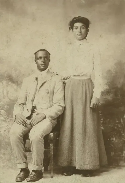 Framed Print : Studio portrait of a young couple, he seated, she with hand on his shoulder, c1900. Creator: Carbon Studio Framed Print : Studio portrait of a young couple, he seated, she with hand on his shoulder, c1900. Creator: Carbon Studio
