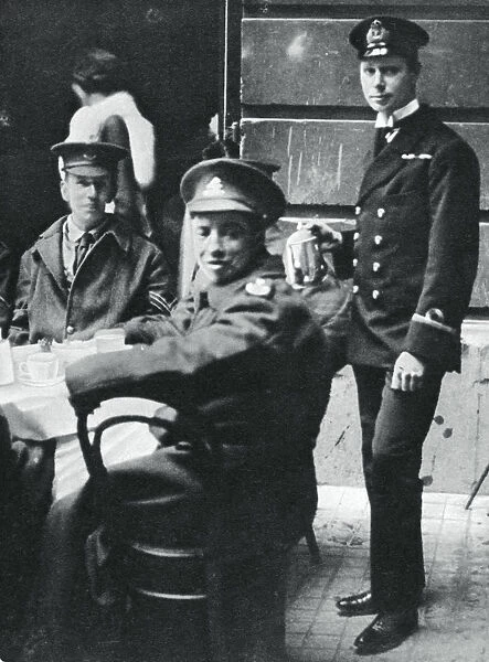 Sub-Lieutenant Prince Albert serving tea to wounded soldiers at Buckingham Palace, 1916