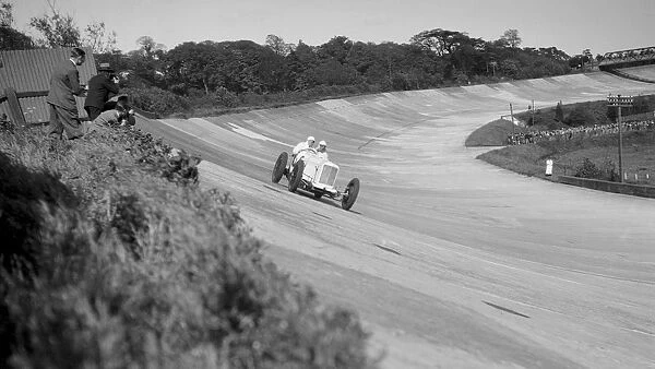 Sunbeam of EL Bouts on the banking, BARC meeting, Brooklands, 16 May 1932. Artist: Bill Brunell