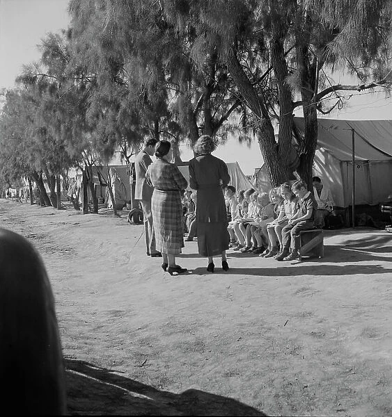 Sunday school for migrant children in a potato pickers camp, Kern County, California, 1937. Creator: Dorothea Lange