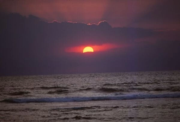 Sunset over Indian Ocean in Hikkaduwa, Sri Lanka, 20th century. Artist: CM Dixon