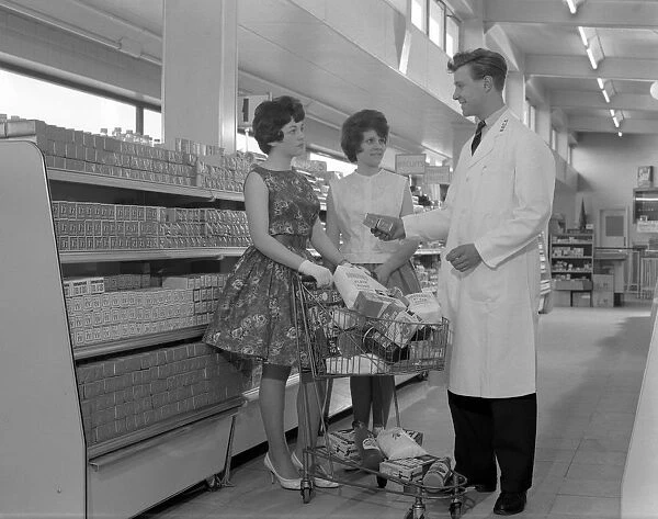 Supermarket shoppers and salesman, Co-op, Barnsley, South Yorkshire, 1961. Artist