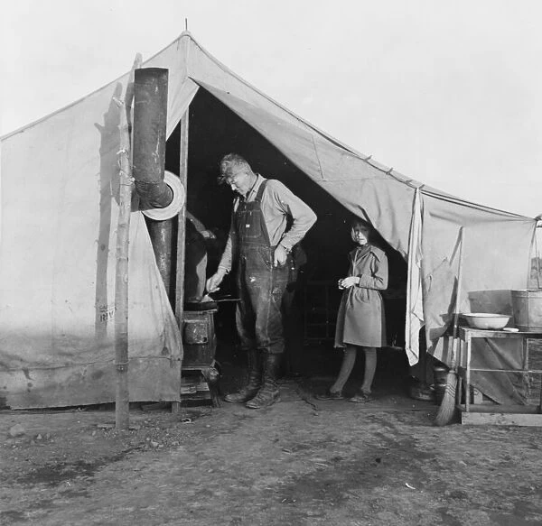 Supper time in FSA migratory emergency camp... in the pea fields, Calipatria, California, 1939. Creator: Dorothea Lange