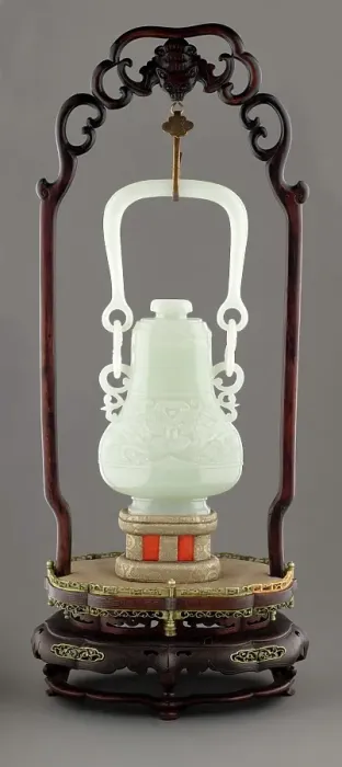 Framed Print : Swing handle vase with mask design on wooden stand, 19th century. Creator: Unknown Framed Print : Swing handle vase with mask design on wooden stand, 19th century. Creator: Unknown
