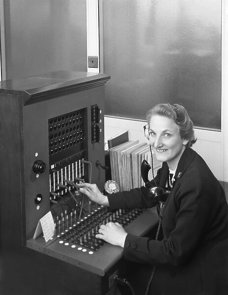 Switch board operator, Spillers Animal Foods, Gainsborough, Lincolnshire, 1960. Artist
