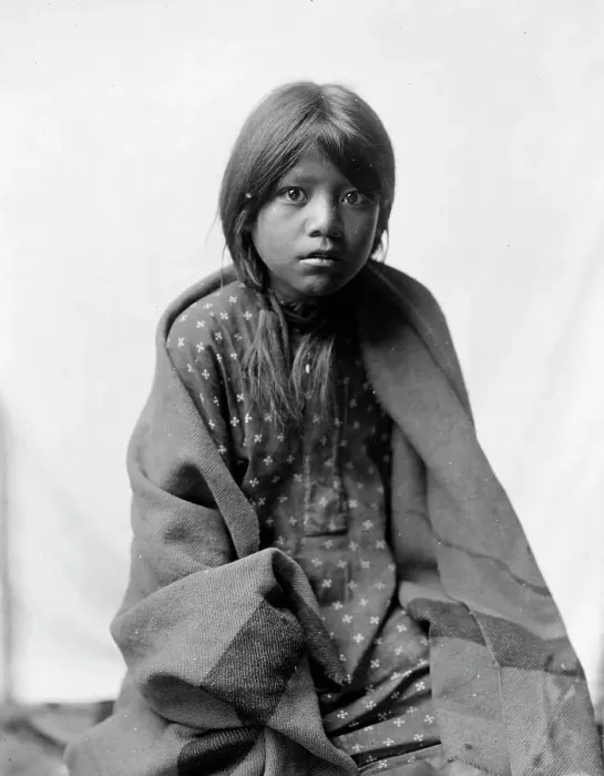 Framed Print : A Taos girl, three-quarter length portrait, seated, facing front, c1905. Creator: Edward Sheriff Curtis Framed Print : A Taos girl, three-quarter length portrait, seated, facing front, c1905. Creator: Edward Sheriff Curtis