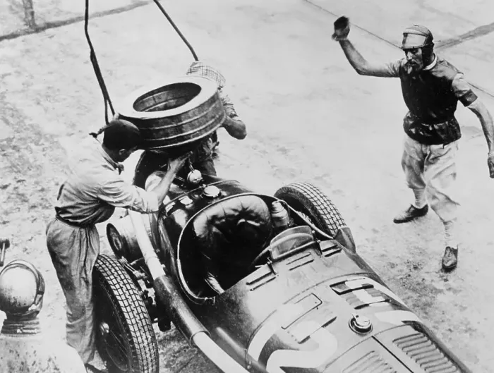 Framed Print : Tazio Nuvolari waiting for his car to be refuelled, c1930s(?)