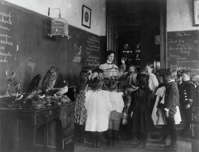 Framed Print : Teacher and group of grade school children standing around bird cage and... Washington DC, (1899?). Creator: Frances Benjamin Johnston Framed Print : Teacher and group of grade school children standing around bird cage and... Washington DC, (1899?). Creator: Frances Benjamin Johnston
