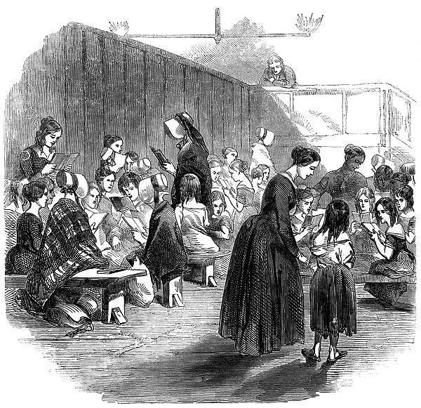 Teaching girls to read in the Ragged School Union school, Lambeth, London, 1868