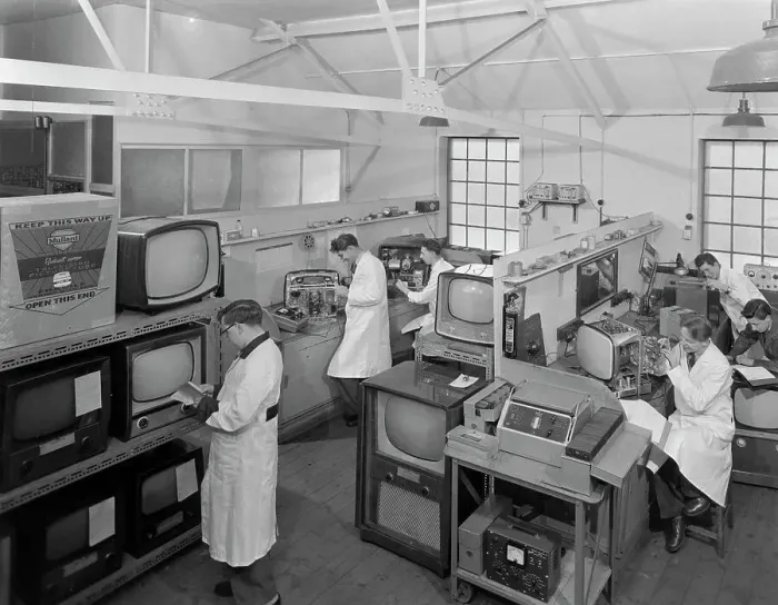 Framed Print : Technicians at work in Clays TV repair in shop, Mexborough, South Yorkshire, February 1959 Framed Print : Technicians at work in Clays TV repair in shop, Mexborough, South Yorkshire, February 1959