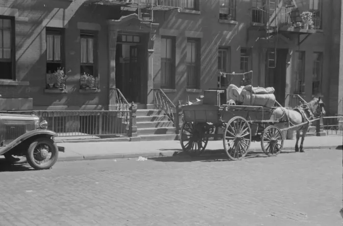 Framed Print : A tenant is moving on horse-drawn wagon, 61st Street between 1st and 3rd Avenues, New York, 1938. Creator: Walker Evans Framed Print : A tenant is moving on horse-drawn wagon, 61st Street between 1st and 3rd Avenues, New York, 1938. Creator: Walker Evans