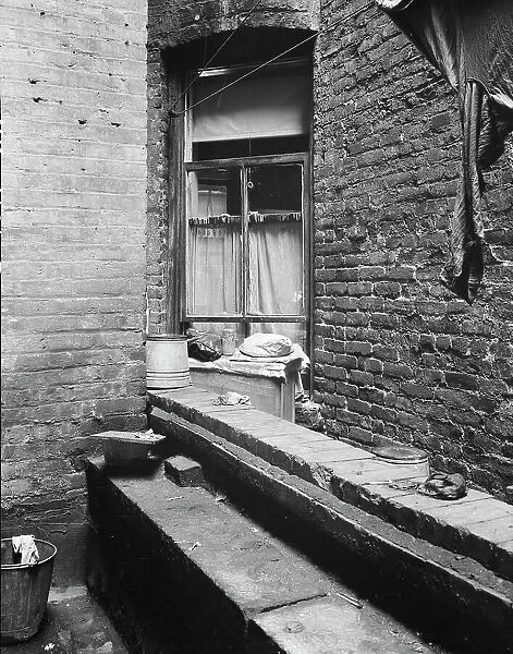 Tenement dwelling of Mr. and Mrs. Jacob Solomon, 133 Aveue D, New York City, 1936. Creator: Dorothea Lange