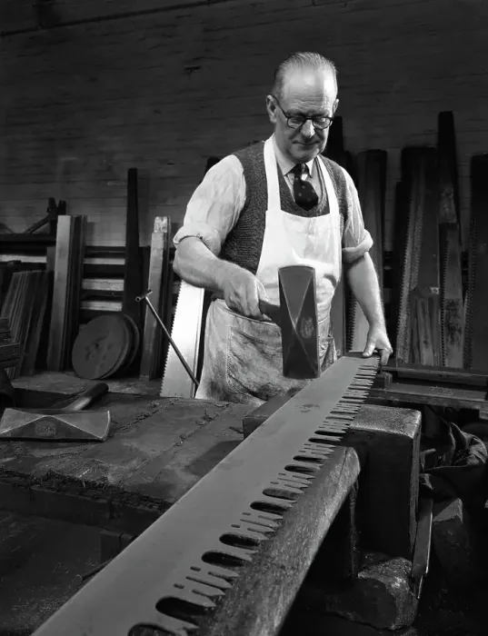 Framed Print : Tensioning the crosscut on a two metre saw blade, Sheffield, South Yorkshire, 1963 Framed Print : Tensioning the crosscut on a two metre saw blade, Sheffield, South Yorkshire, 1963