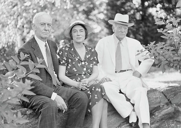 Timken, W.R. Mr. and Mrs. and John Hemming Fry, seated outdoors, 1938 July. Creator: Arnold Genthe