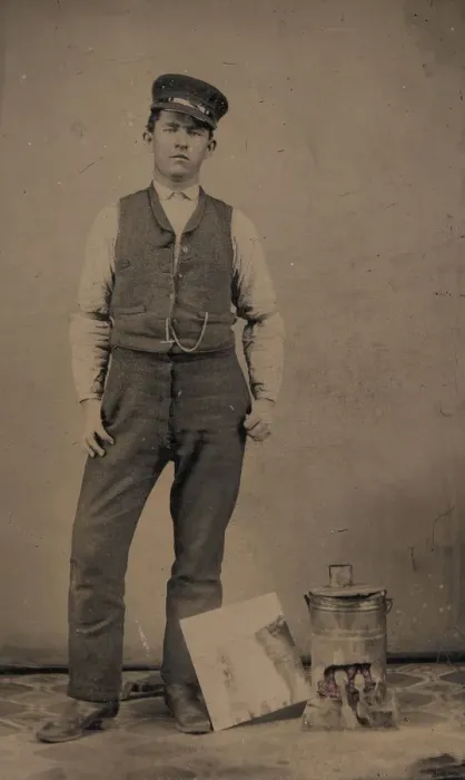 Framed Print : Tinsmith with Coal Heater and Sheet of Tin, 1870s-80s. Creator: Unknown Framed Print : Tinsmith with Coal Heater and Sheet of Tin, 1870s-80s. Creator: Unknown