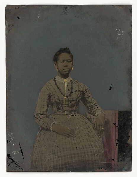 Tintype of a seated young woman, 1850-1875. Creator: Unknown