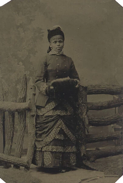 Tintype of woman in jacket and dress with hat and muff, 1880s. Creator: Unknown