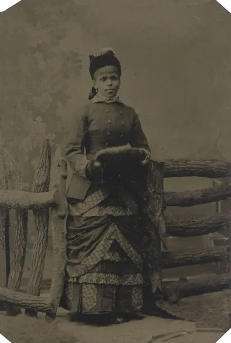 Framed Print : Tintype of woman in jacket and dress with hat and muff, 1880s. Creator: Unknown Framed Print : Tintype of woman in jacket and dress with hat and muff, 1880s. Creator: Unknown