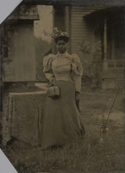 Framed Print : Tintype of a woman wearing a dress with hat and bag, 1890s. Creator: Unknown Framed Print : Tintype of a woman wearing a dress with hat and bag, 1890s. Creator: Unknown