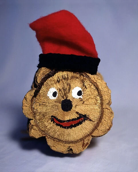 Tio de Nadal (Christmas log) with barretina (typical Catalan hat)