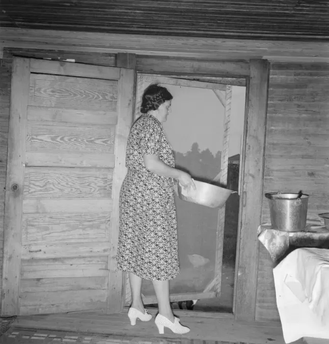 Framed Print : Tobacco sharecroppers wife disposing of dishwater... Person County, North Carolina, 1939. Creator: Dorothea Lange Framed Print : Tobacco sharecroppers wife disposing of dishwater... Person County, North Carolina, 1939. Creator: Dorothea Lange