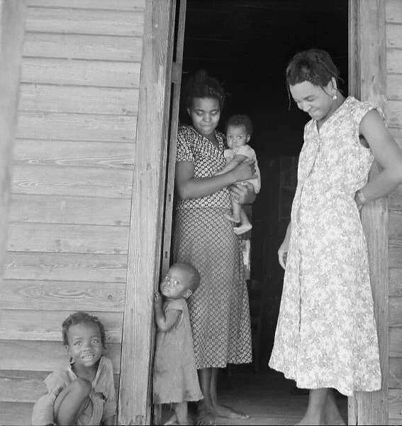 Two tobacco tenant mothers (related) with part of their children, Wake County, North Carolina, 1939. Creator: Dorothea Lange