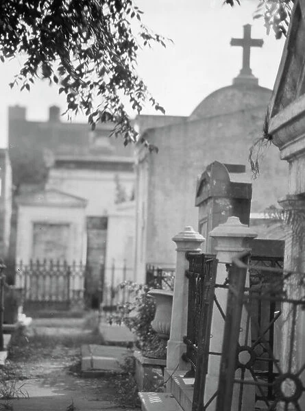 Tombs in St. Louis Cemetery, New Orleans, between 1920 and 1926. Creator: Arnold Genthe