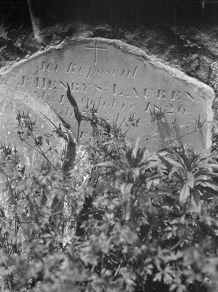 Tombstone in St. Louis Cemetery, New Orleans, between 1920 and 1926. Creator: Arnold Genthe