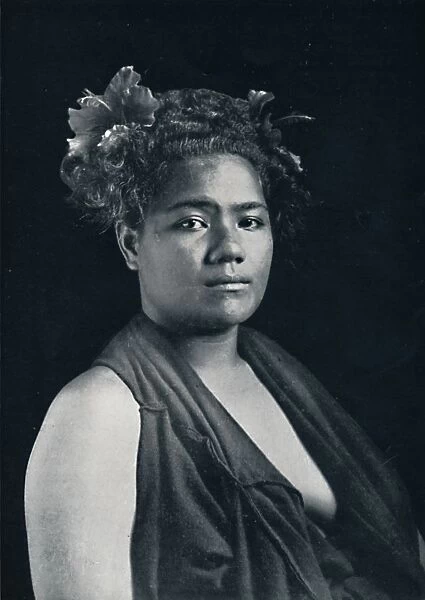 A Tongan woman, with scarlet hibiscus blossoms in her hair, 1902. Artist: JJ Lister