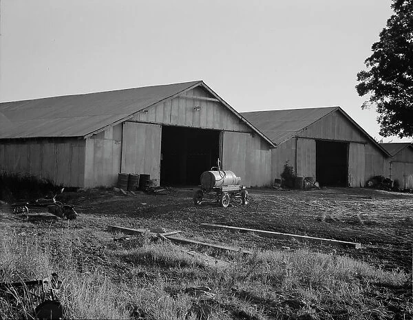 Tractor garage at the Aldridge Plantation near Leland, Mississippi, 1937. Creator: Dorothea Lange