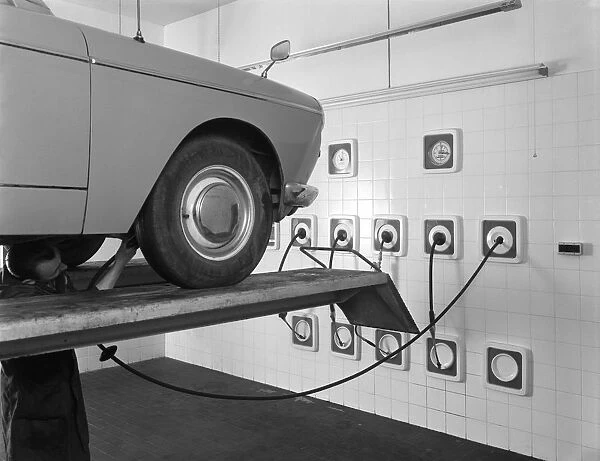 A traditional lubrication bay and mechanic at a garage, Sheffield, South Yorkshire, 1965