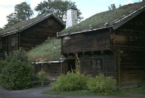 Traditional Swedish farm building with a turf roof