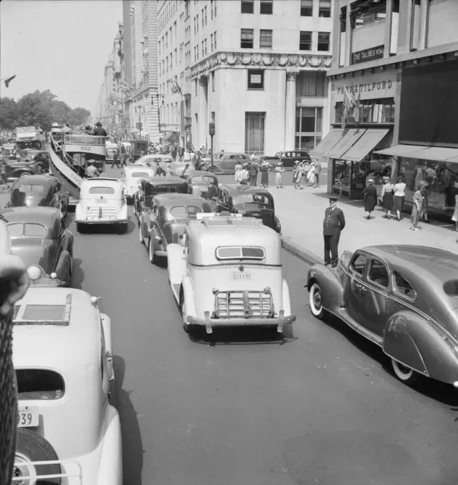 Framed Print : Traffic on Fifth Avenue approaching 57th Street on a summer afternoon, New York City, 1939. Creator: Dorothea Lange Framed Print : Traffic on Fifth Avenue approaching 57th Street on a summer afternoon, New York City, 1939. Creator: Dorothea Lange