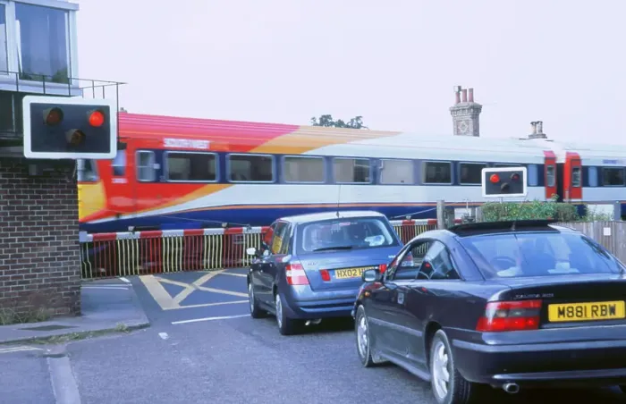 Framed Print : Traffic queue at level crossing in Brockenhurst, Hampshire Framed Print : Traffic queue at level crossing in Brockenhurst, Hampshire