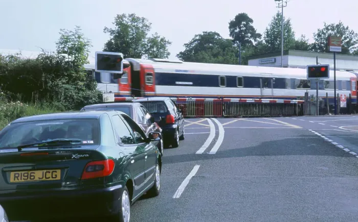 Framed Print : Traffic queue at level crossing in Brockenhurst, Hampshire Framed Print : Traffic queue at level crossing in Brockenhurst, Hampshire