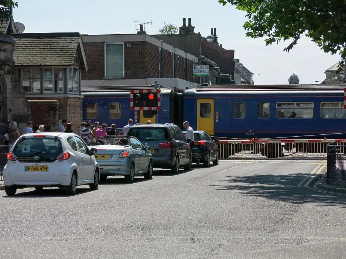 Framed Print : Train passing through level crossing in Lincoln 2014