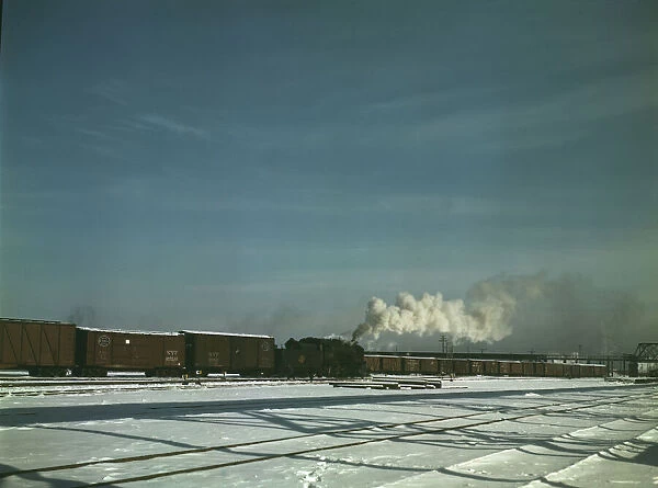 A train pulling out of the freight house at C & NW RRs Proviso(?) yard, Chicago, Ill. 1942. Creator: Jack Delano