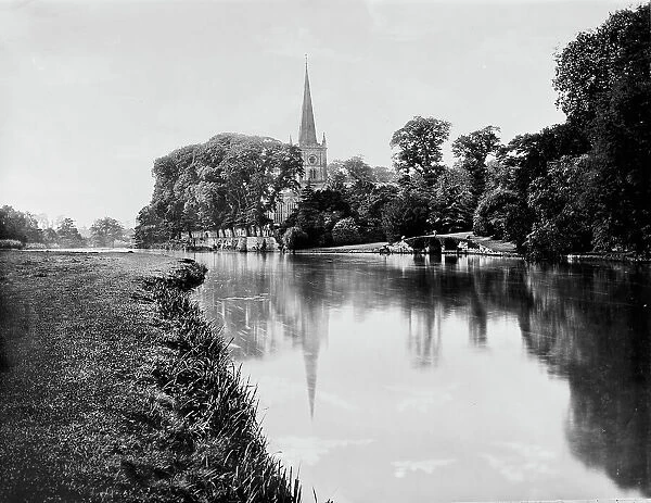 Trinity Church by river, Stratford-on-Avon, between 1900 and 1910. Creator: William H. Jackson