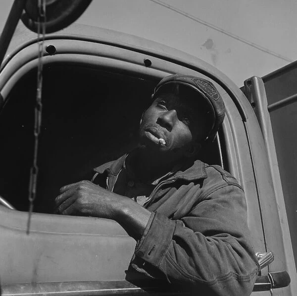 Truck driver for the Alaska Coal Company, Washington, D. C. 1942. Creator: Gordon Parks