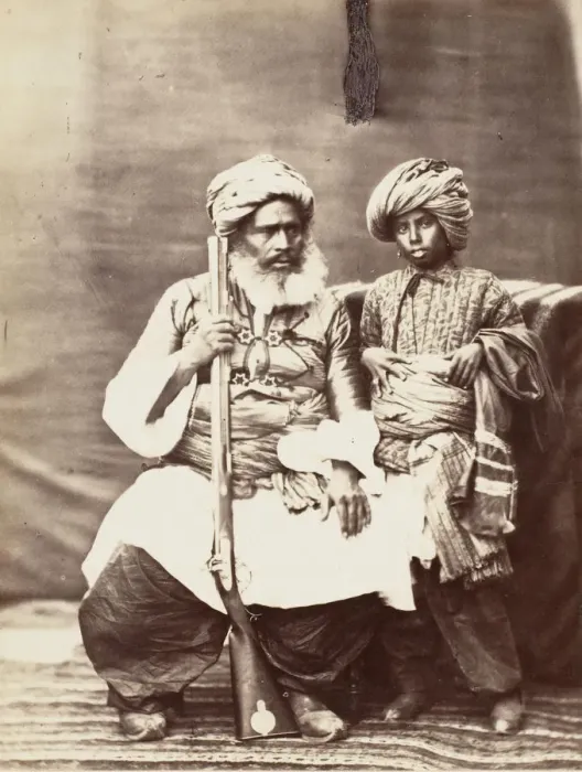 Framed Print : Turbaned Man Holding Rifle with Boy Alongside, 1860s. Creator: Unknown Framed Print : Turbaned Man Holding Rifle with Boy Alongside, 1860s. Creator: Unknown