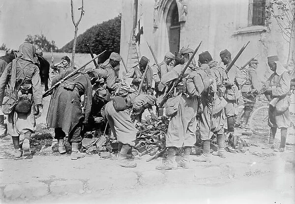 Turcos Examining War Booty at Neufmentiers, 1914. Creator: Bain News Service