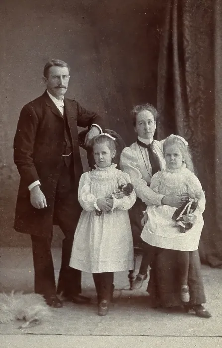Framed Print : Unidentified family with two girls holding dolls. Creator: Priyalalls Photography Framed Print : Unidentified family with two girls holding dolls. Creator: Priyalalls Photography