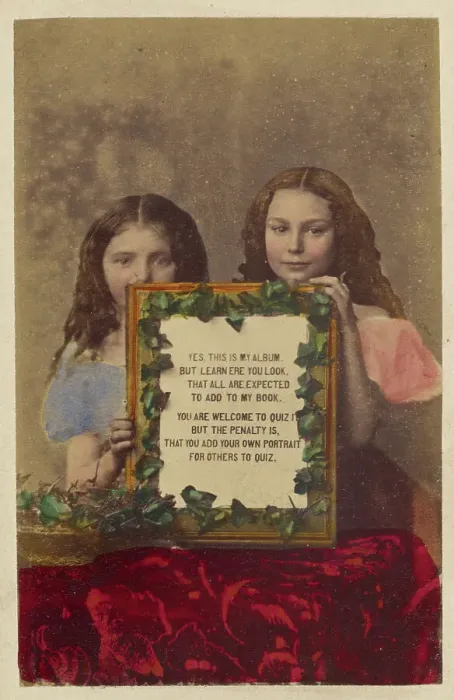 Framed Print : Two unidentified girls holding a framed picture with text, 1870-1875. Creator: Burgwitz & Company Framed Print : Two unidentified girls holding a framed picture with text, 1870-1875. Creator: Burgwitz & Company