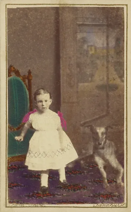 Framed Print : Unidentified little girl standing with a dog on the floor next to her, 1865-1875. Creator: Bent Framed Print : Unidentified little girl standing with a dog on the floor next to her, 1865-1875. Creator: Bent