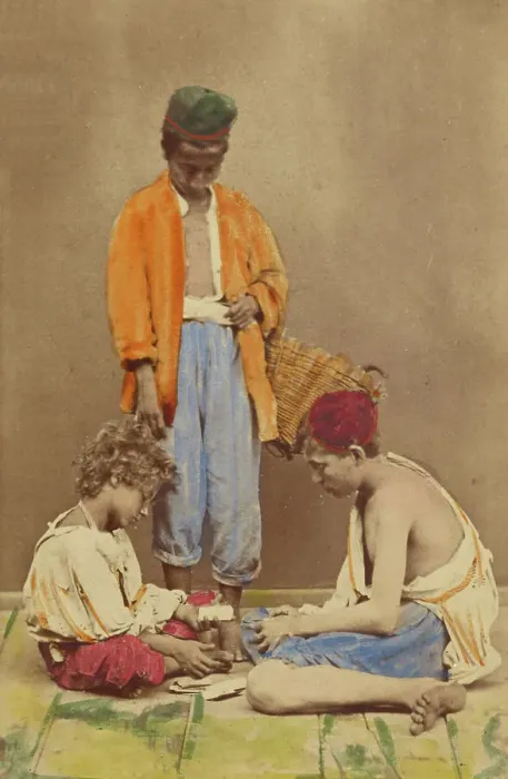 Framed Print : Unidentified man with basket standing, plus two boys seated playing cards, 1865-1870. Creator: Giorgio Conrad Framed Print : Unidentified man with basket standing, plus two boys seated playing cards, 1865-1870. Creator: Giorgio Conrad