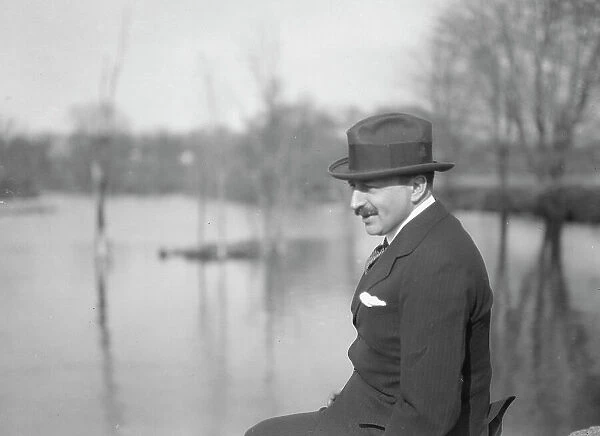 Unidentified man, seated outdoors, between 1896 and 1942. Creator: Arnold Genthe