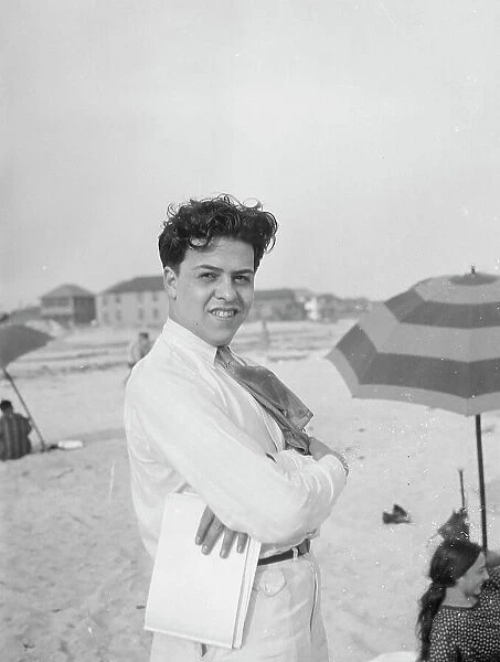 Unidentified member of the Albert Rothbart group at the beach, between 1920 and 1935. Creator: Arnold Genthe