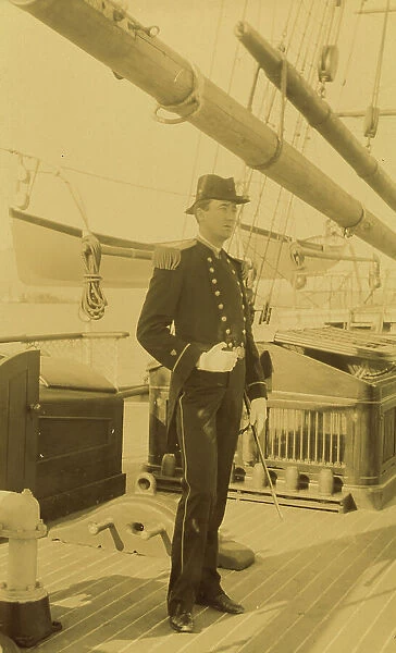 Unidentified naval officer, full-length portrait, standing aboard ship, facing right, 1894 or 1895. Creator: Alfred Lee Broadbent